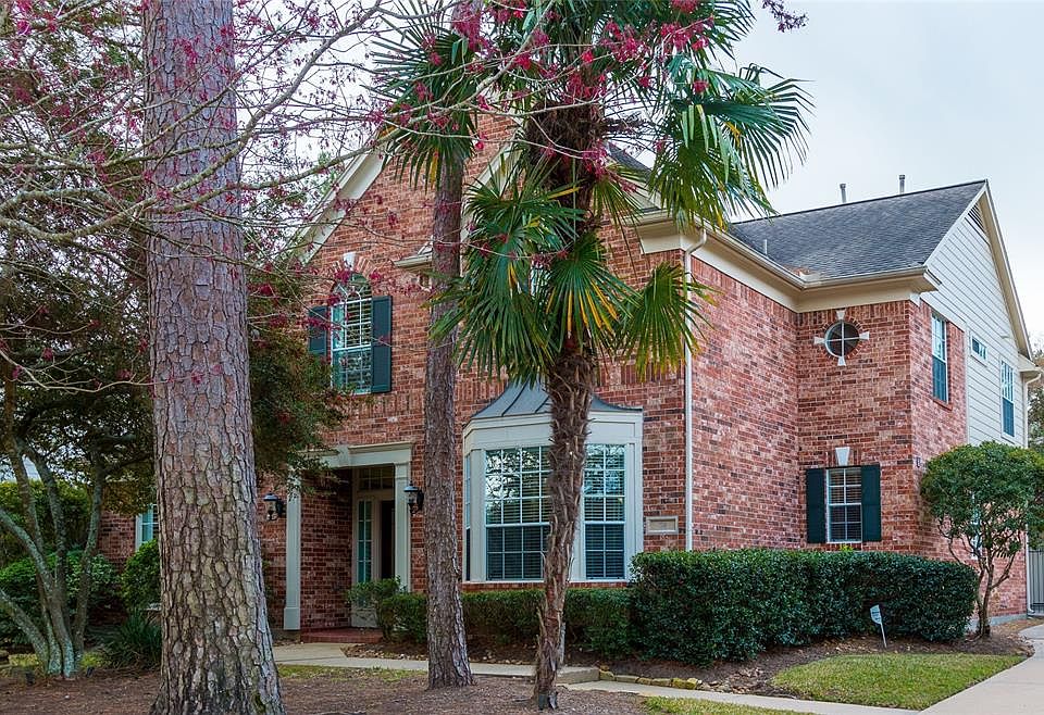 74 E. Slatestone is a lovely 5 BR mostly brick home in the convenient and popular Village of Alden Bridge of The Woodlands. The front yard features what The Woodlands is famous for, trees!