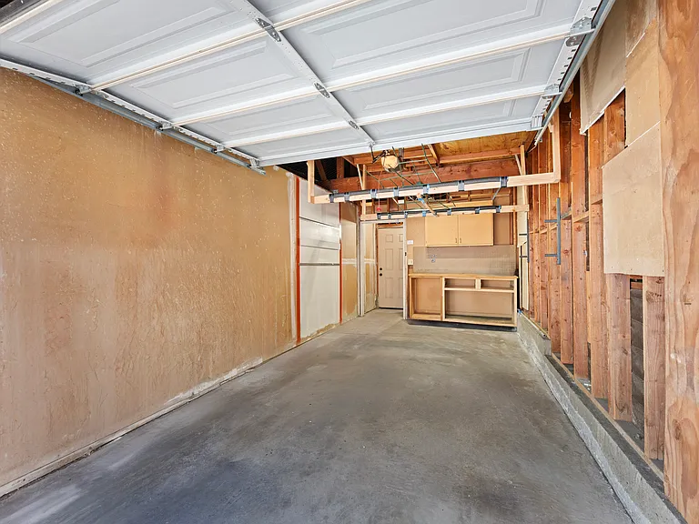 Enclosed car garage right outside of front door