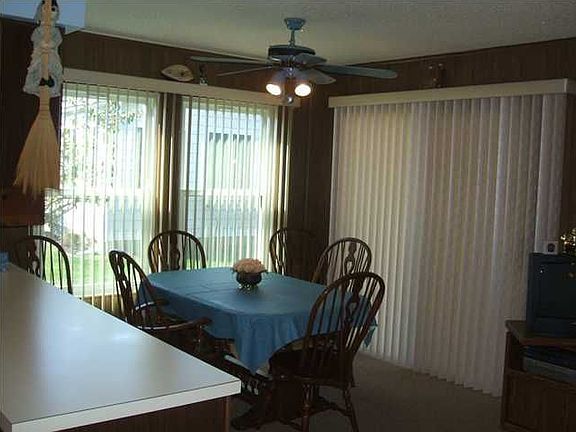 This eat-in-kitchen overlooks the well-maintained yard. 