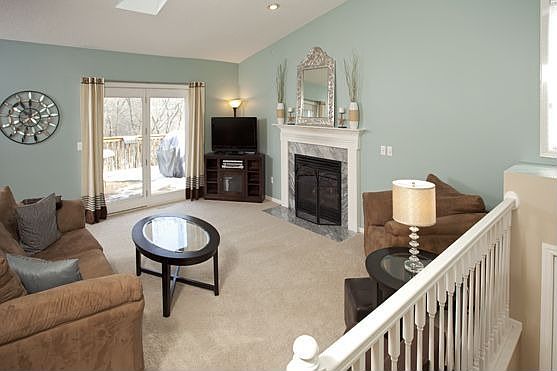 Great floor plan with fireplace and double doors out to the private deck