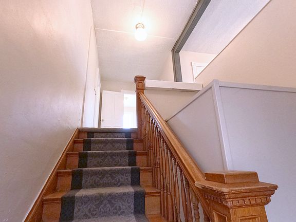 The staircase. Half of a grand staircase. The lower half is closed off from the downstairs apartment.