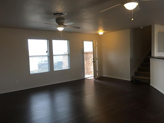 Downstairs living room...new vinyl plank flooring...waterproof for kids and dogs...