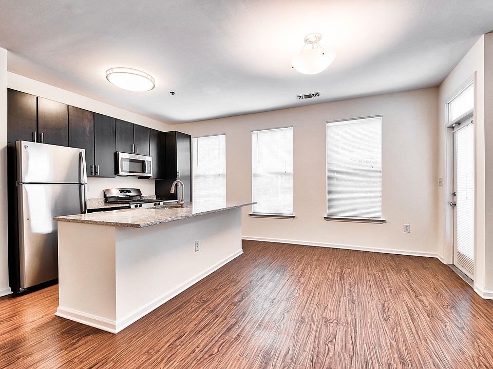 Open-Concept Floor Plans with luxury black walnut vinyl flooring