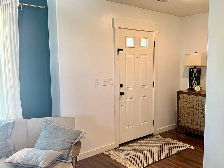 Entry with front living room and entry closet.
