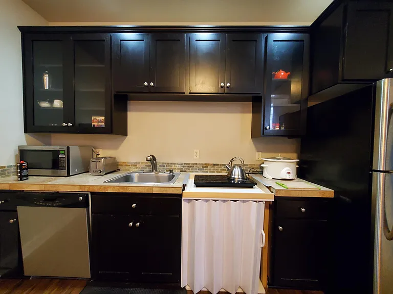 kitchenette includes micro, air fryer, toaster and slow cooker