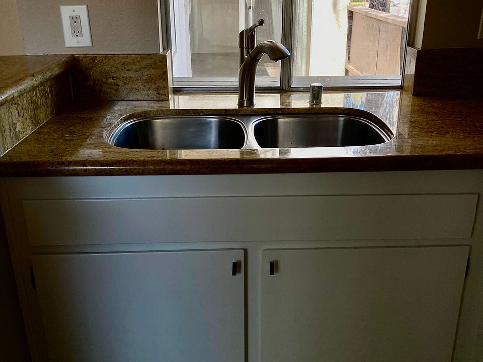 Kitchen window over looking balcony.
Outside of window is large attached
wood counter for passing food and drinks
