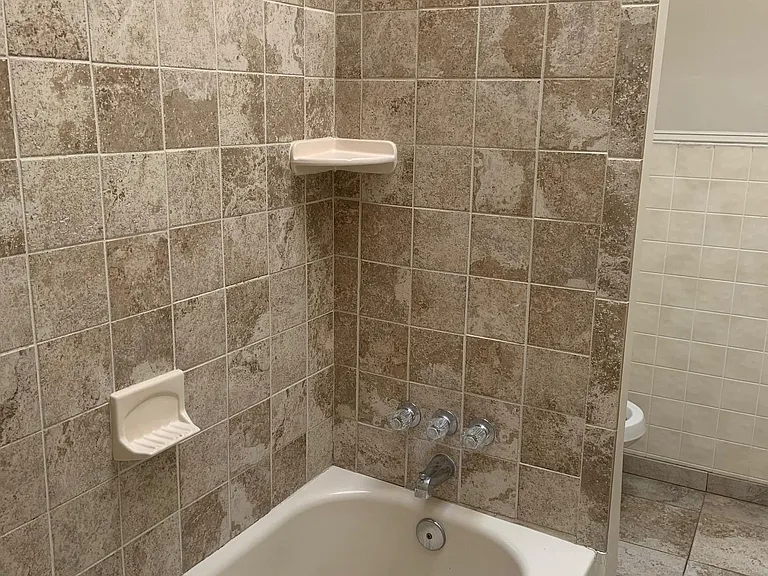1st Bathroom with Bath Tub on the left as you enter the Apartment