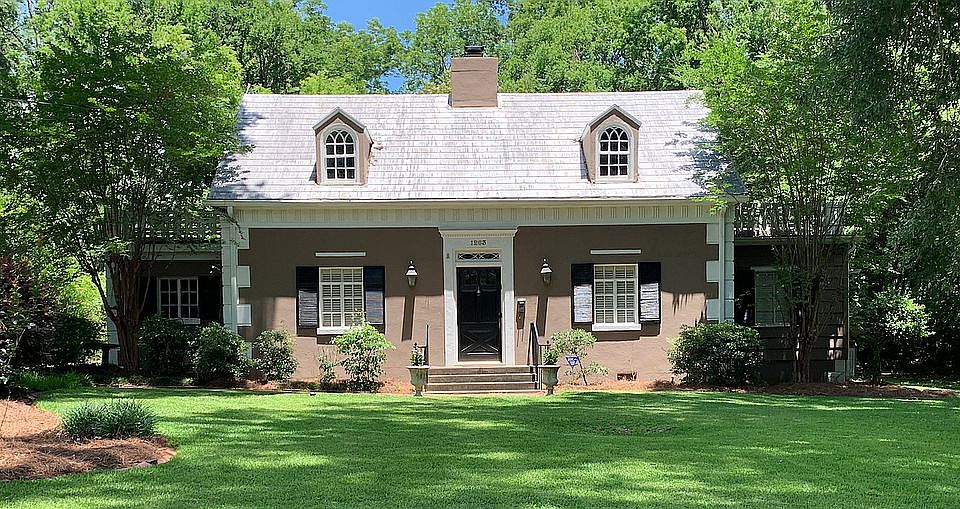 Stucco & cement + metal roof
