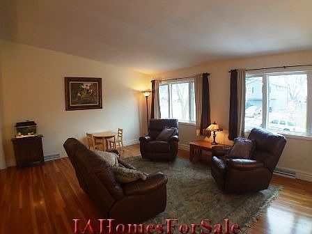 Living Room - Spacious, hardwood floors, vaulted ceiling, large baseboards, large windows.  House is located on one of the highest spots in Cedar Rapids.  See for miles.