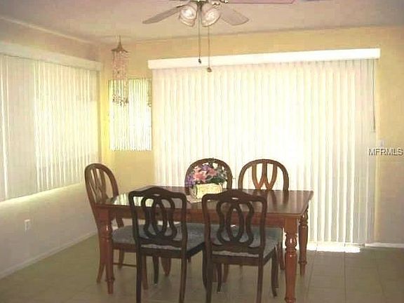 Dining room has sliders that open to the lanai