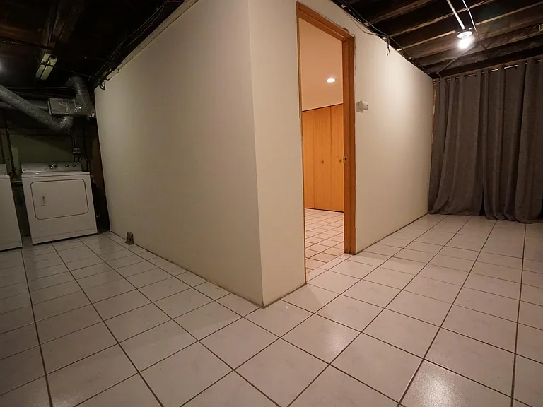 Finished bonus room in basement for office use or storage