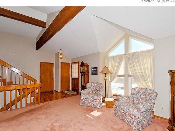 Hardwood entry with closet close to garage entrance