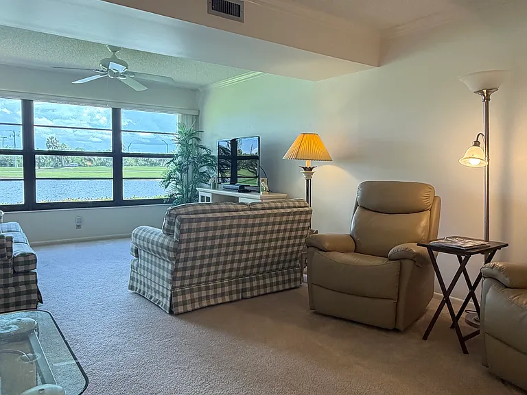Cozy up to STUNNING lake & golf course views from the living area!