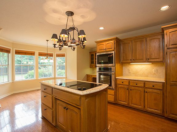 Beautiful hardwood floors seamlessly integrate the Kitchen, Breakfast Nook and Formal Dining Room.