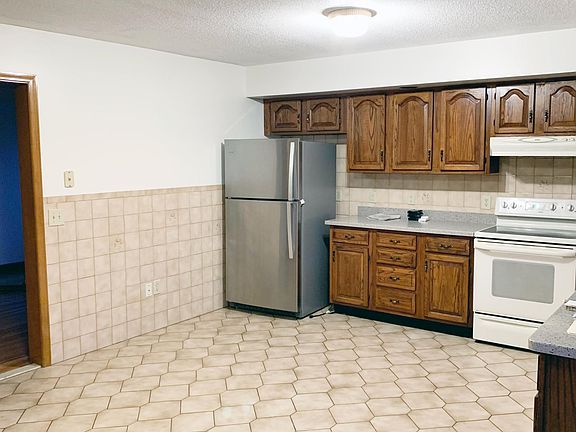 Large kitchen fits a 6 person table with outside access to top level deck