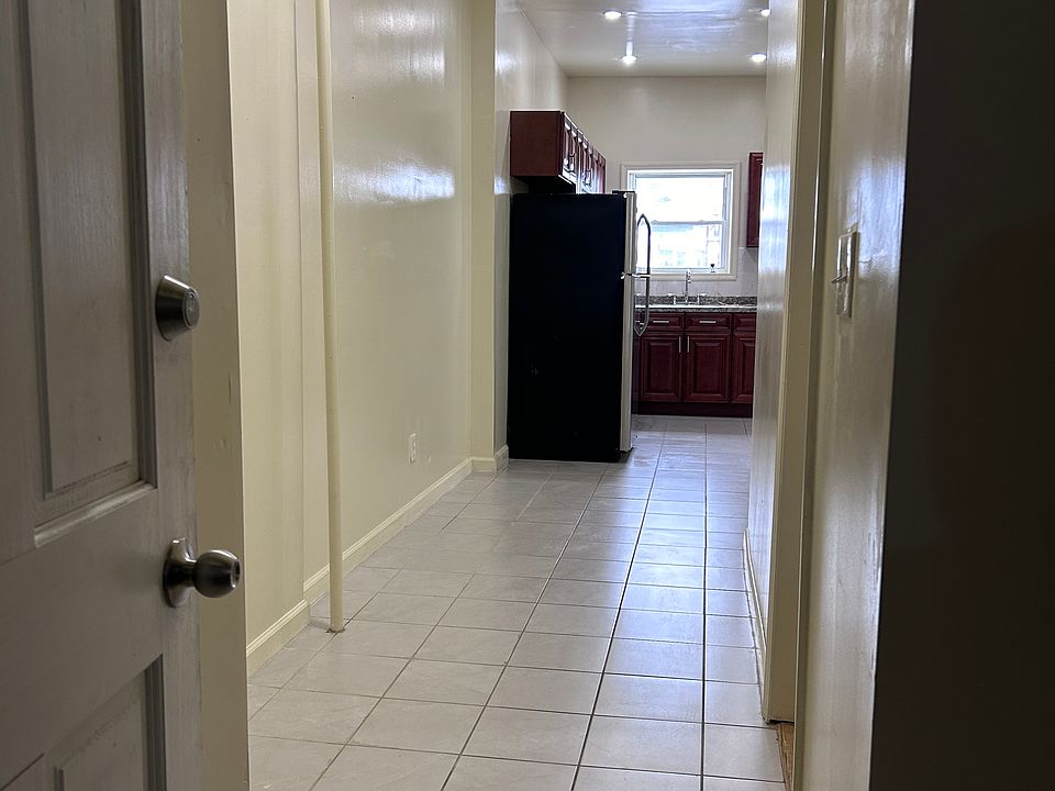 walkway to kitchen and 2 bedrooms