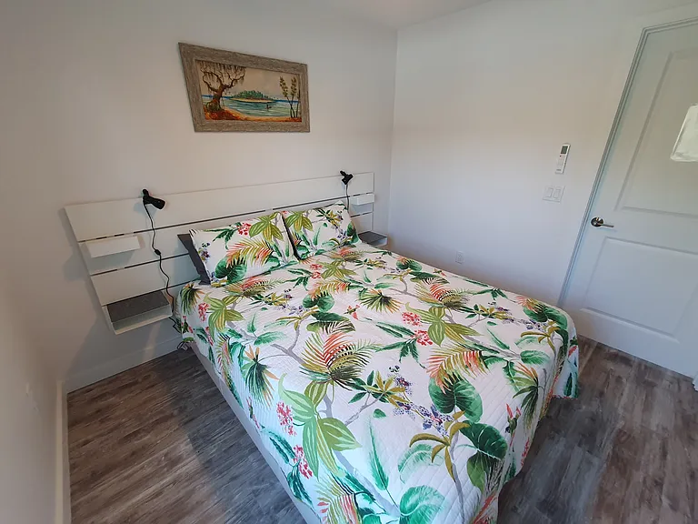 Small bedroom with full closet and drawers under the bed