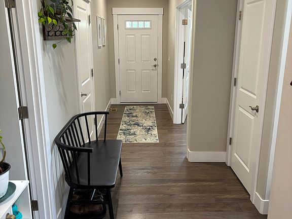 Front Entryway; Bonus room (far right); Hall Walk-in Closet under the stairs (near right); 1/2 Bath (near left); Garage Door (far left)
