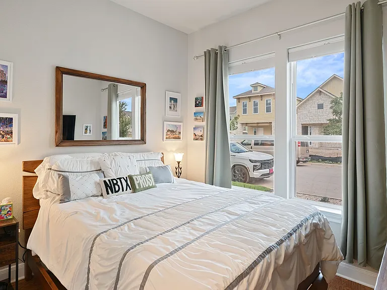 4th bedroom (on 1st floor) shown with queen-size bed