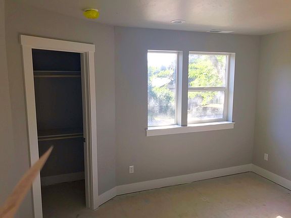Front bedroom with large walk in closet and decorator paint