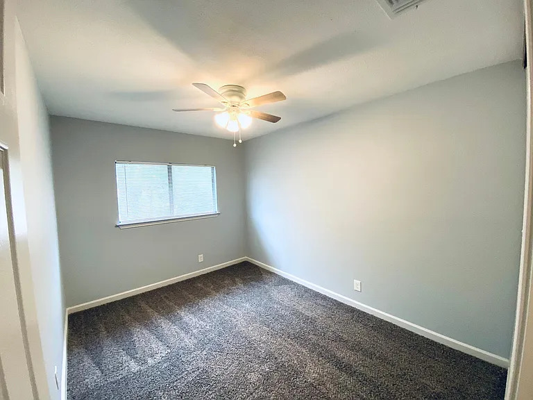 Upstairs back bedroom.