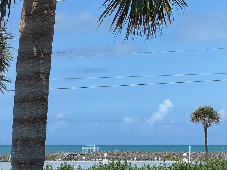 View of the pool (and the ocean), from "your" unit