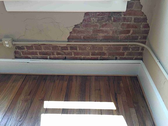 Exposed brick accents and original oak floors