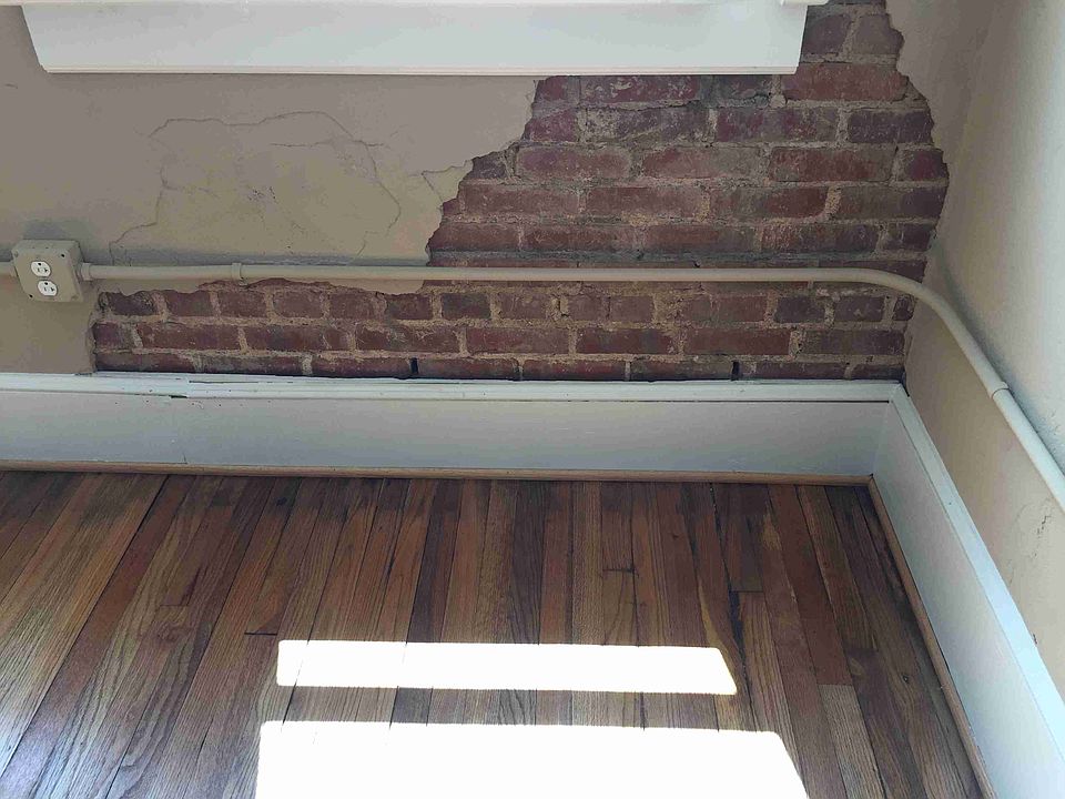 Exposed brick accents and original oak floors