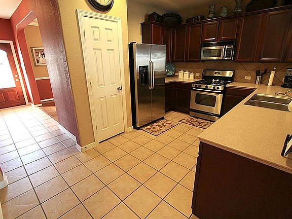 Spacious kitchen with ample cabinets and counter space.