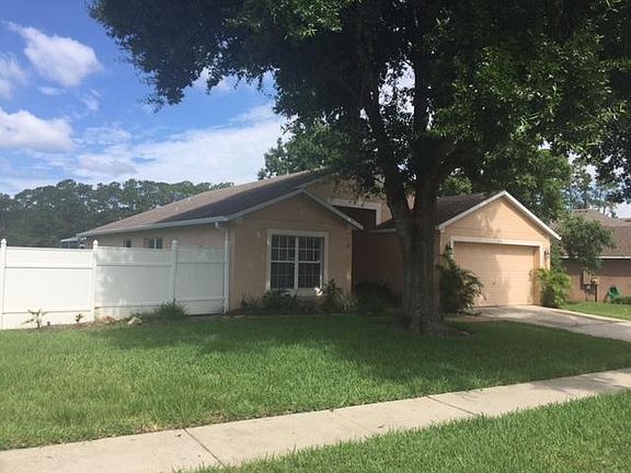 Front side of fenced home