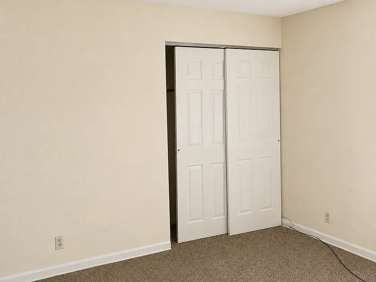 Master Bedroom View #2 with double closet and ceiling fan