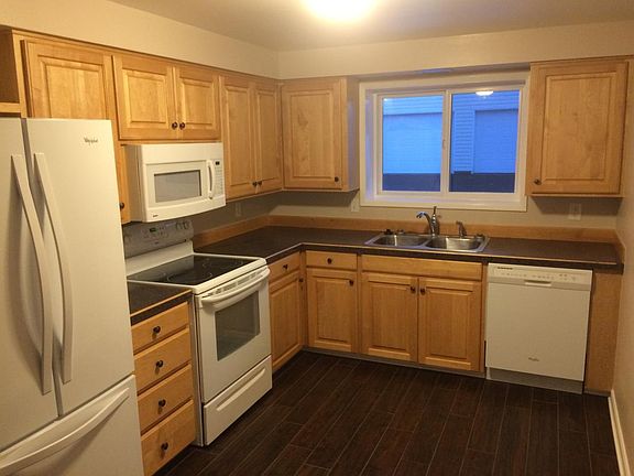 Spacious kitchen.New wood plank style tile in the kitchen, h