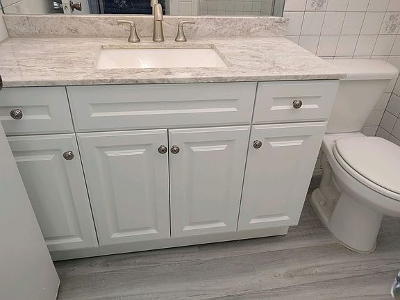 Master Bathall redone floorsfaucet