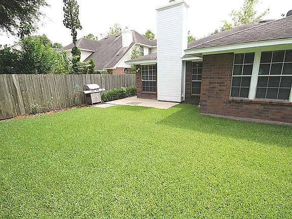 Concrete patio off the rear of the home is perfect for relaxing or entertaining guests.