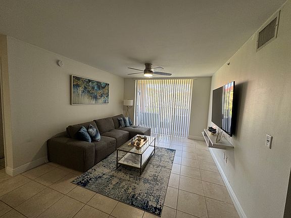 Living room with new blinds and fan