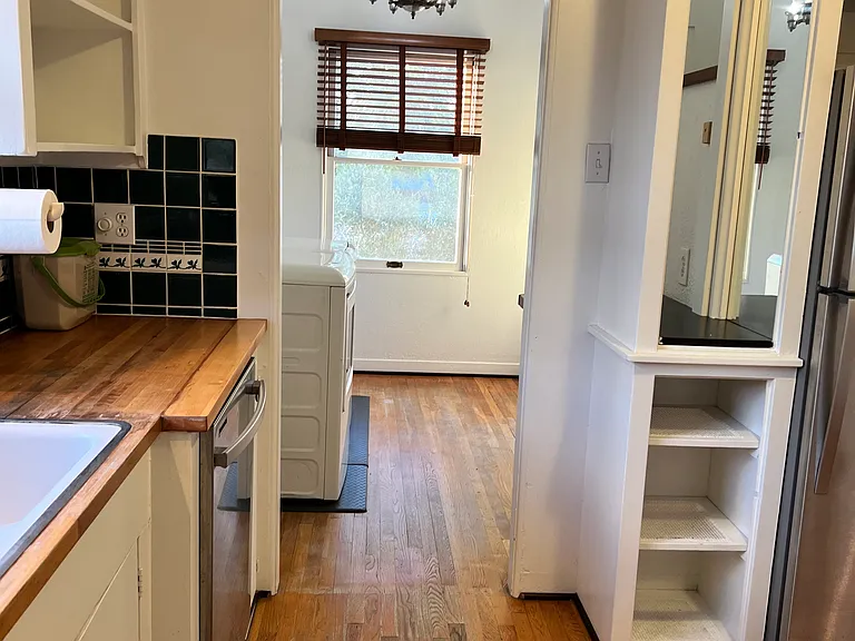view into laundry with pantry closet extra storage
