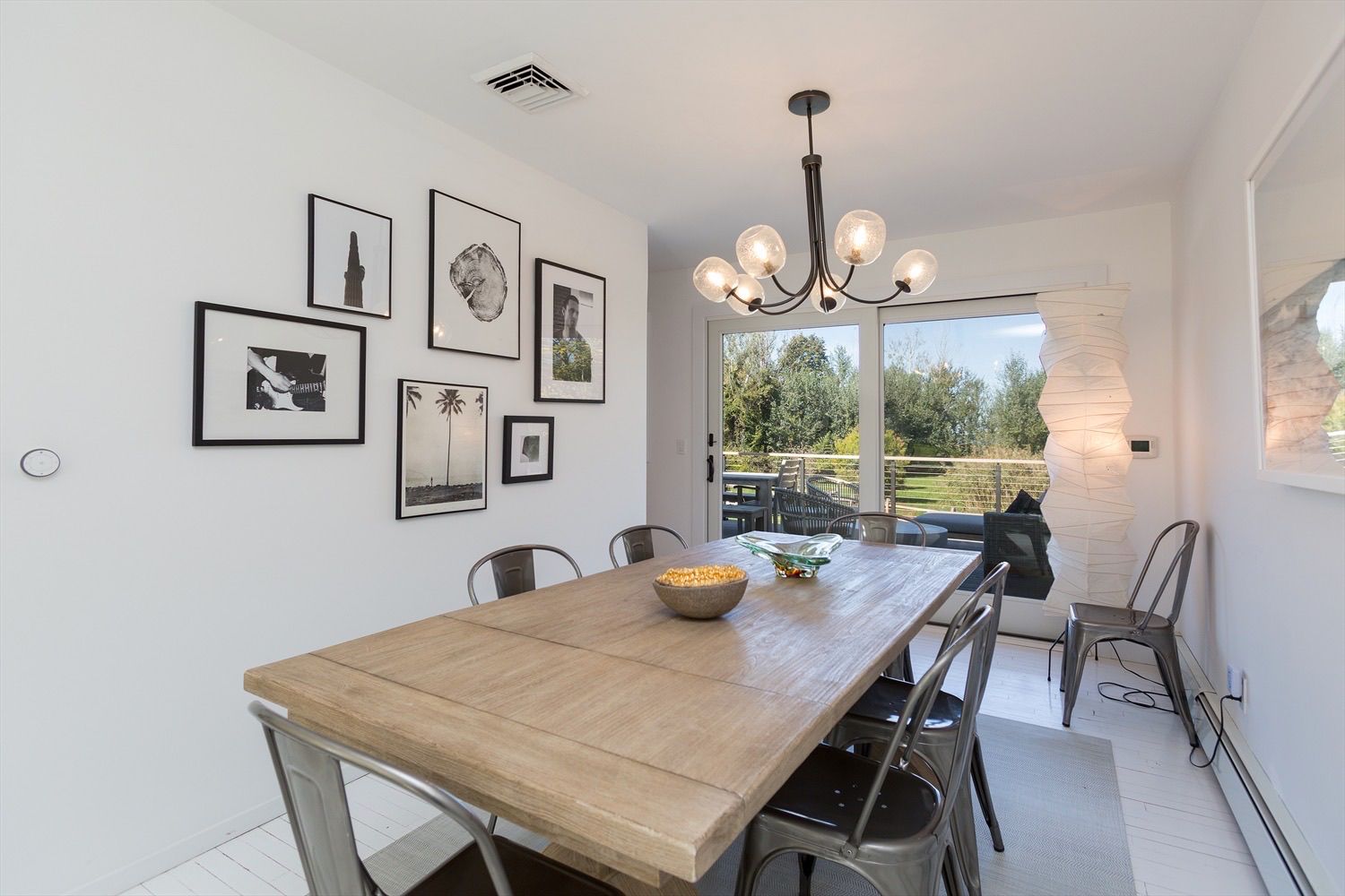  Dining room comfortably seats 8 and opens onto the deck.
