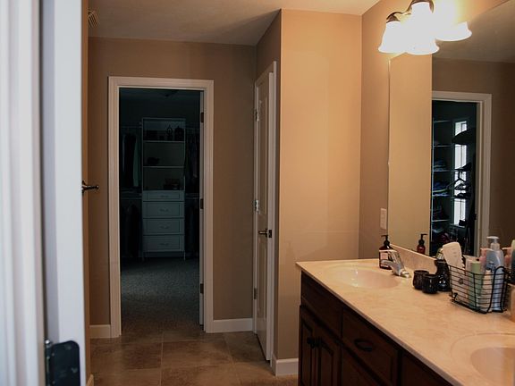 Master bathroom and entrance to closet
