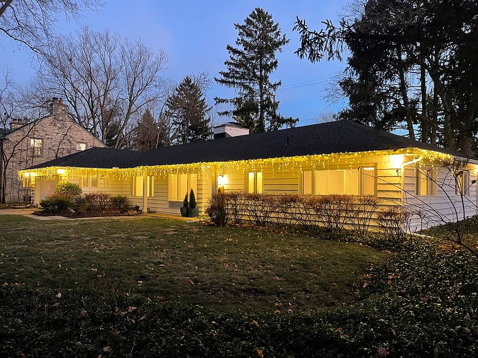 Front outdoor view with lights at dusk