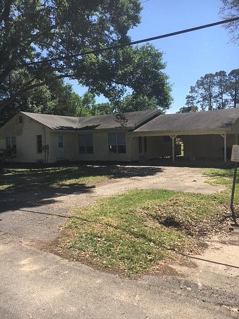 Driveway from 2nd street - beautiful home with carport with 