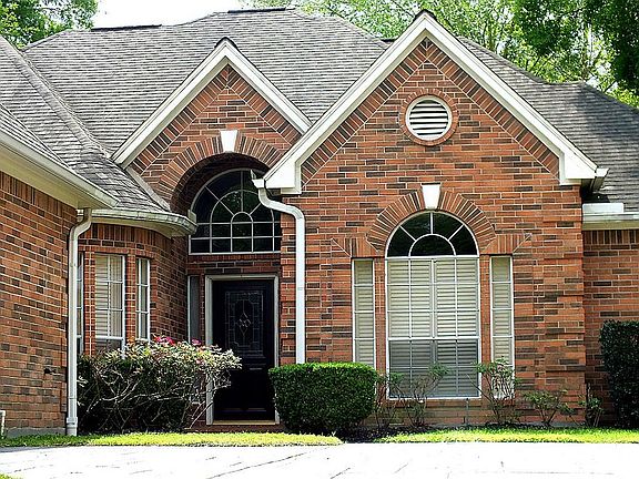 The house is brick on all sides, and lovingly maintained.