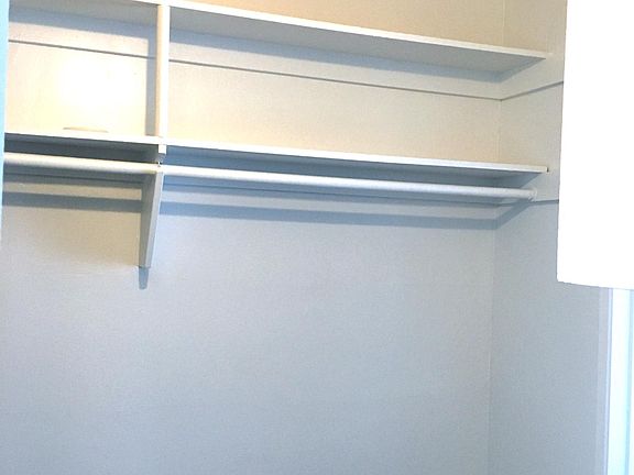 Cultivate your capsule wardrobe in your spacious walk in closet.