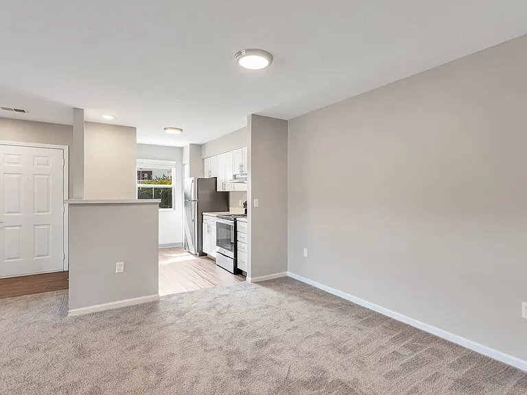 Experience open-concept living with seamless flow between the kitchen and living areas, professionally managed by Highlands Vista Group.