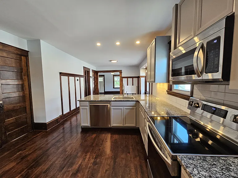 Eat at breakfast bar with plenty of leg space for stools.