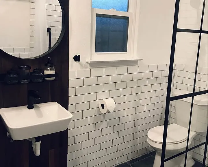 Laundry area and full bathroom with walk-in shower
