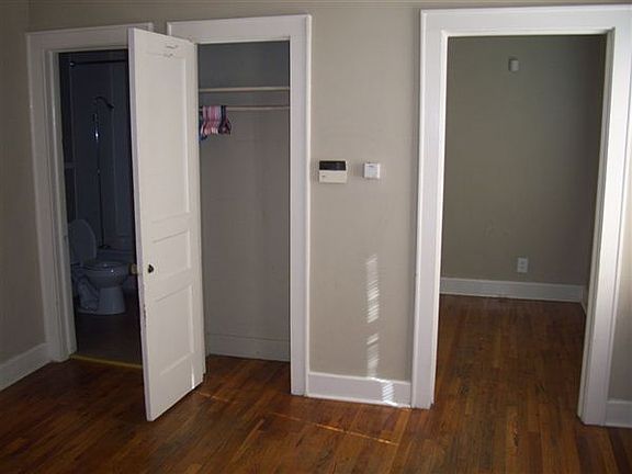 bedroom with bath access and closet