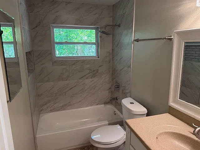 Updated bathroom with granite shower enclosure