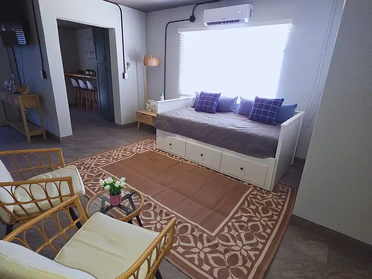 Enjoy natural light and fresh ambiance through large windows and stylish blinds.