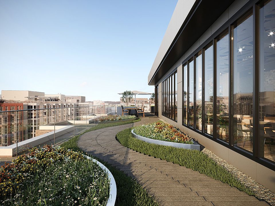 Spacious penthouse clubhouse lounge with outdoor terrace located on the rooftop