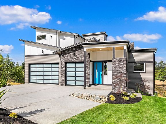 Covered Front Patio o 3 Car Garages o Standard Features include 100,000 in upgrades ...